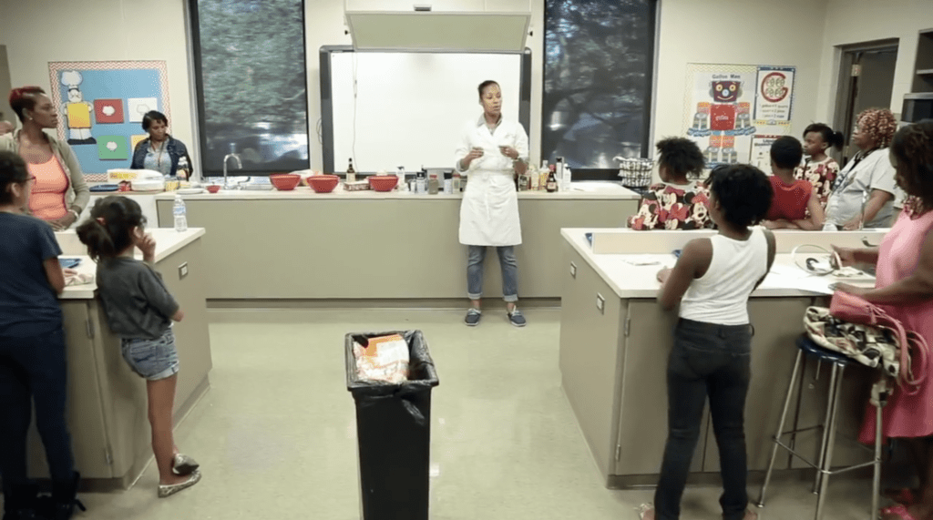 Home ec teacher teaching students how to cook